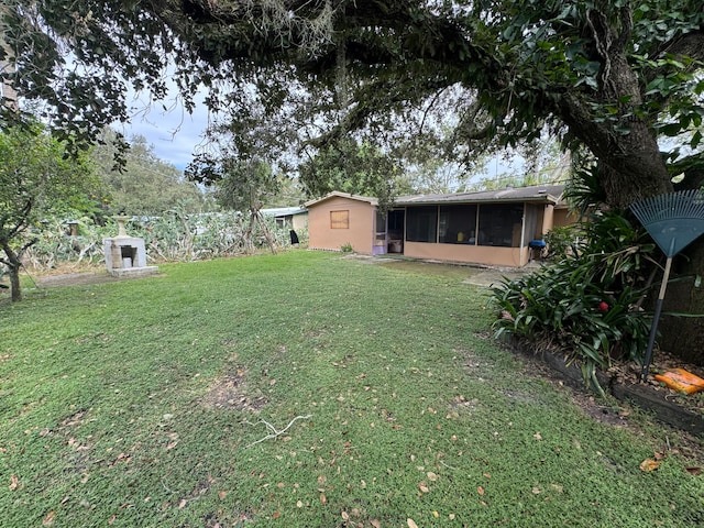 view of yard with a sunroom