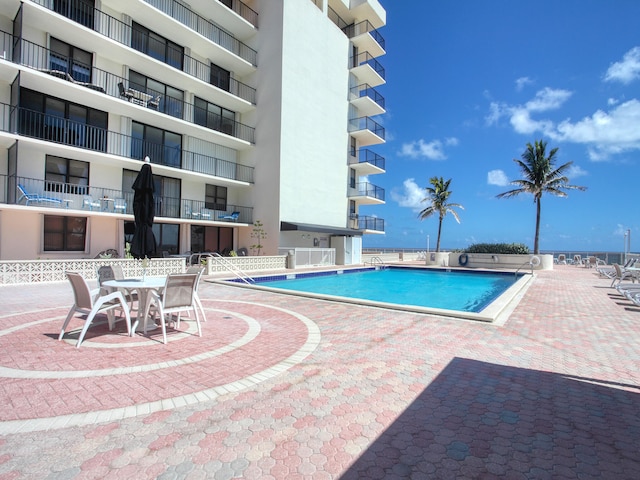 view of pool featuring a patio area