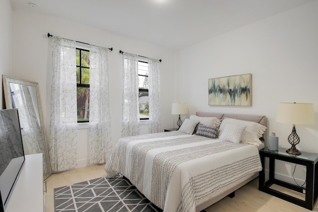 bedroom with hardwood / wood-style floors