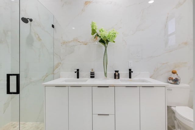 bathroom with tile walls, vanity, toilet, and walk in shower