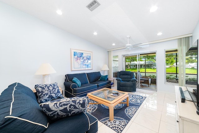 tiled living room featuring ceiling fan and lofted ceiling