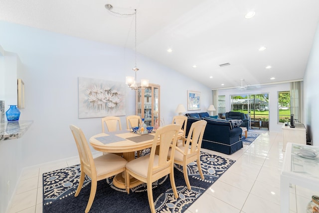 dining room with lofted ceiling, an inviting chandelier, and light tile patterned flooring