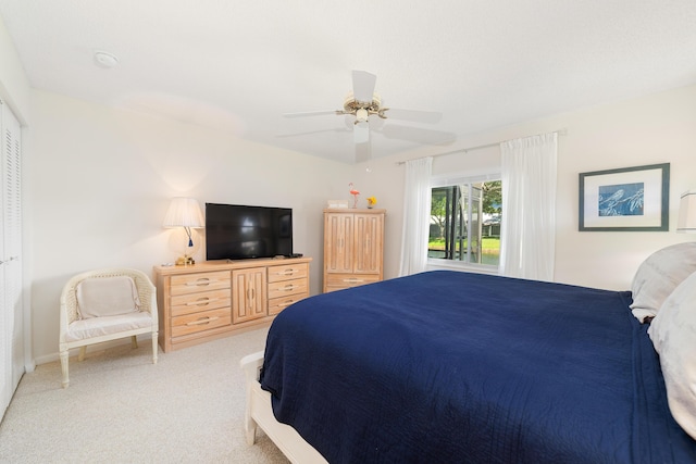 bedroom with ceiling fan and carpet flooring