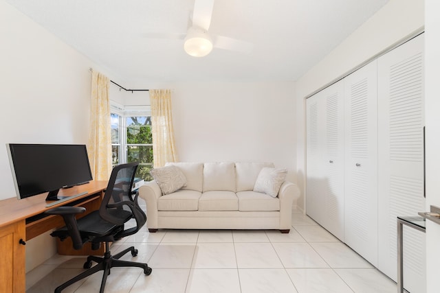 office space featuring ceiling fan and light tile patterned flooring