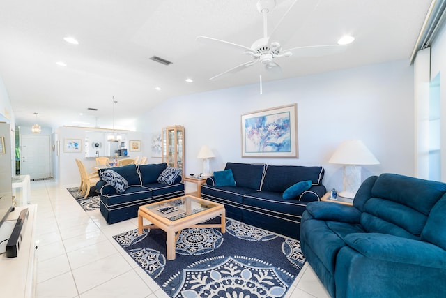 tiled living room with lofted ceiling and ceiling fan