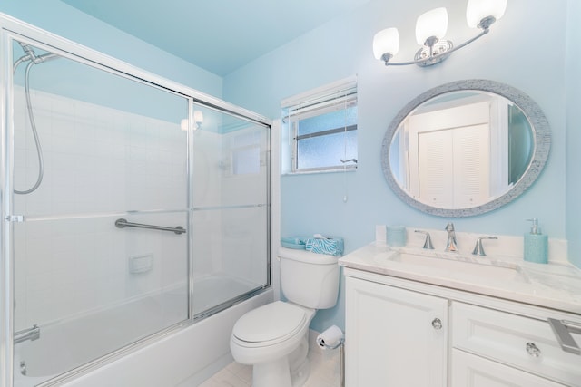 full bathroom with toilet, combined bath / shower with glass door, vanity, and tile patterned flooring