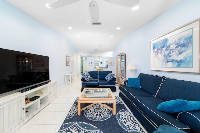 tiled living room with vaulted ceiling and ceiling fan