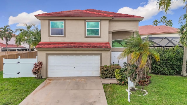 mediterranean / spanish-style home with a garage and a front lawn