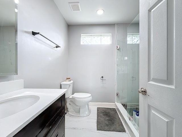 bathroom with walk in shower, vanity, and toilet