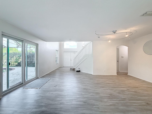 empty room with hardwood / wood-style flooring