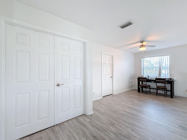 bedroom featuring light hardwood / wood-style flooring and ceiling fan