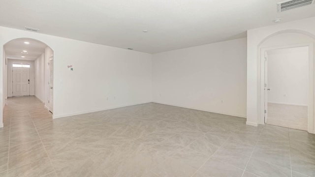 empty room with light tile patterned floors