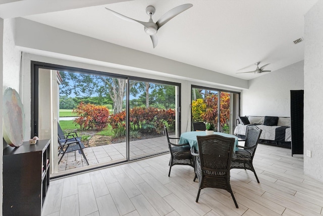 dining area featuring light hardwood / wood-style floors and ceiling fan