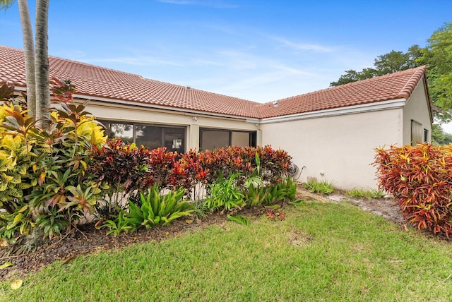 view of property exterior featuring a yard