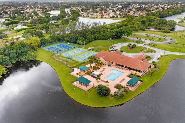 birds eye view of property with a water view