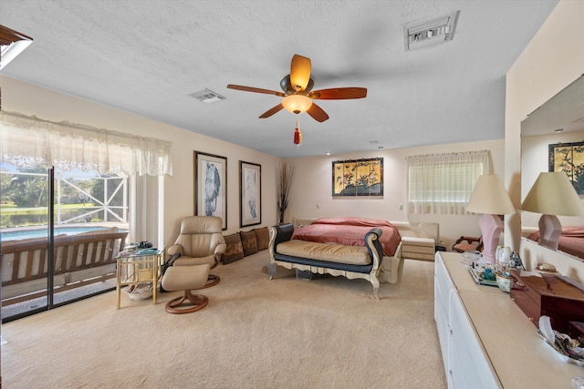 5609 SE Lamay Dr, Stuart, FL 34997 - bedroom featuring carpet, access to outside, and a ceiling fan