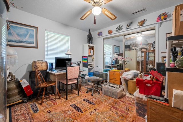 5609 SE Lamay Dr, Stuart, FL 34997 - office space featuring ceiling fan and healthy amount of natural light