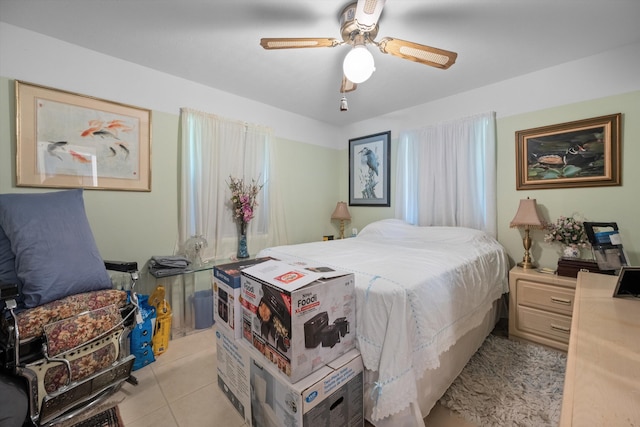 5609 SE Lamay Dr, Stuart, FL 34997 - bedroom with light tile patterned floors and ceiling fan