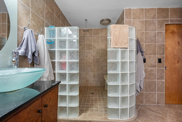 5609 SE Lamay Dr, Stuart, FL 34997 - bathroom with walk in shower, tile walls, and vanity