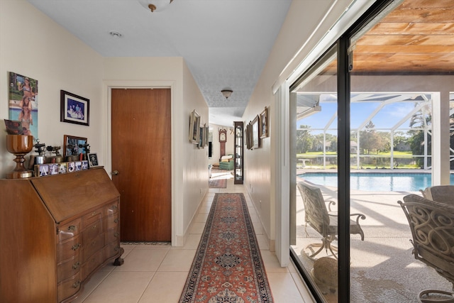 5609 SE Lamay Dr, Stuart, FL 34997 - hall featuring light tile patterned flooring and a sunroom