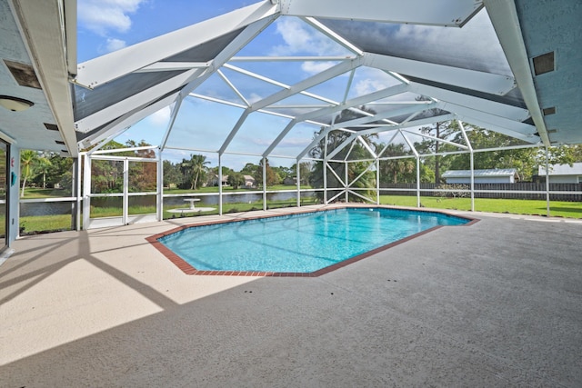 view of pool featuring a patio, a lanai, a yard, and a water view