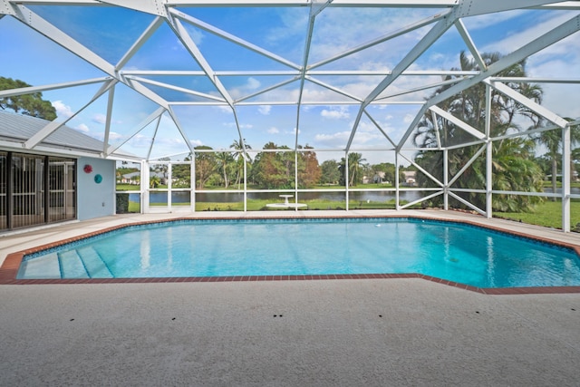 5609 SE Lamay Dr, Stuart, FL 34997 - outdoor pool with a patio, a water view, and a lanai