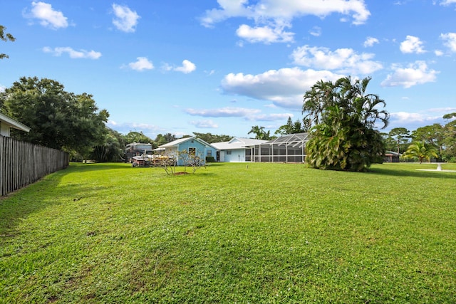 view of yard featuring a lanai