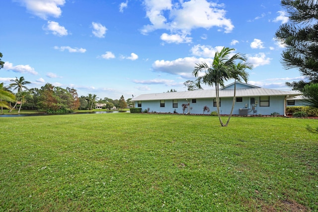 5609 SE Lamay Dr, Stuart, FL 34997 - view of green lawn with a water view and cooling unit