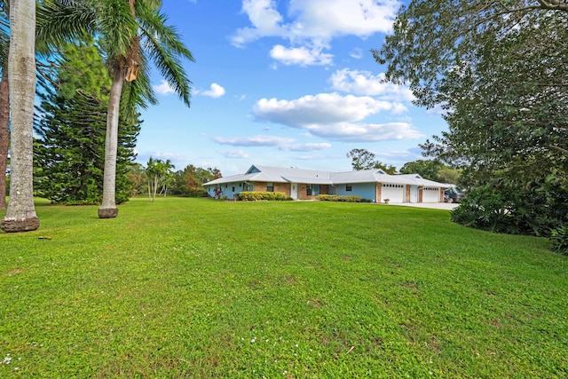 view of yard featuring a garage