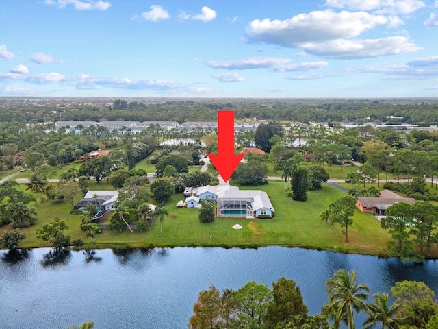 5609 SE Lamay Dr, Stuart, FL 34997 - drone / aerial view of a large body of water and a tree filled landscape