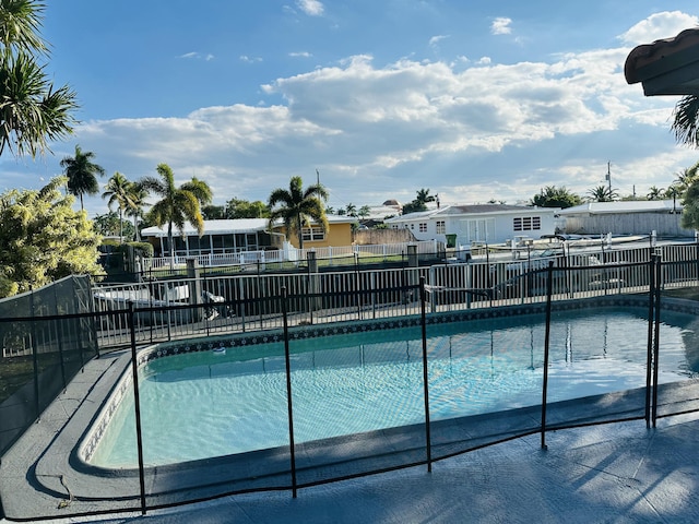 view of pool with fence and a fenced in pool