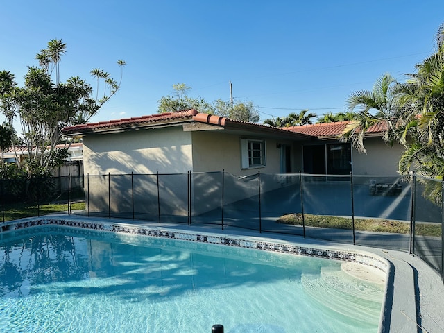 view of swimming pool featuring a fenced in pool and fence