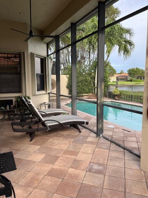 view of pool featuring ceiling fan