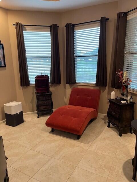 living area featuring light tile patterned floors