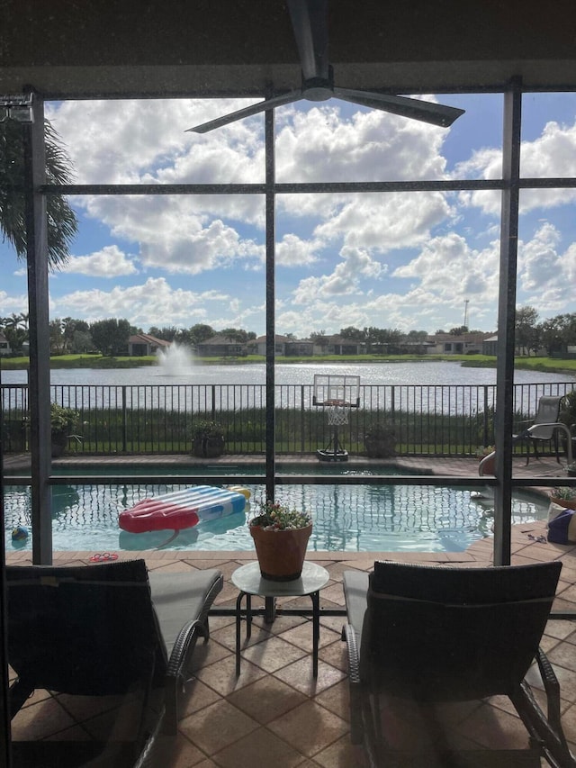 view of swimming pool featuring a water view