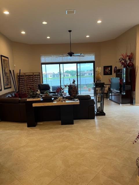 interior space featuring ceiling fan