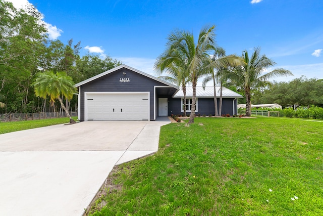 ranch-style home featuring a front yard and a garage