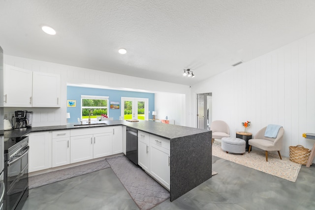 kitchen featuring kitchen peninsula, white cabinetry, stainless steel dishwasher, french doors, and sink