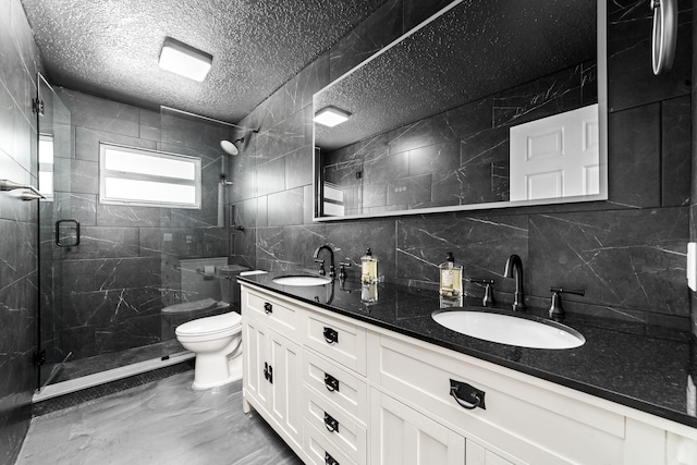 bathroom with a shower with door, a textured ceiling, toilet, vanity, and decorative backsplash