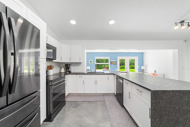 kitchen featuring french doors, kitchen peninsula, black appliances, white cabinets, and a textured ceiling