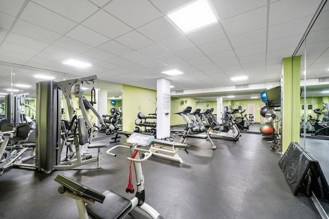 exercise room featuring a drop ceiling