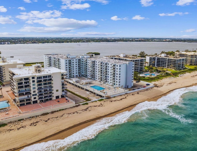 bird's eye view featuring a water view and a view of the beach