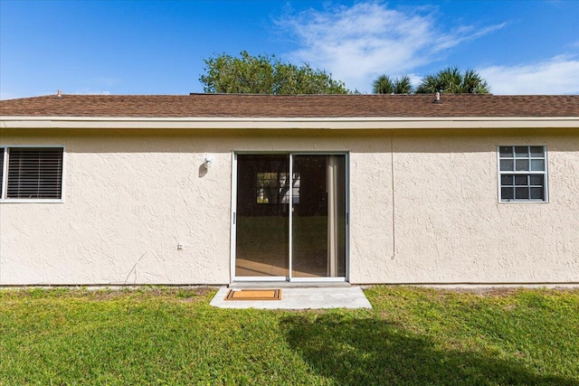 rear view of house with a yard