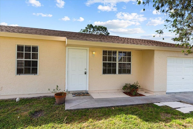 entrance to property featuring a garage