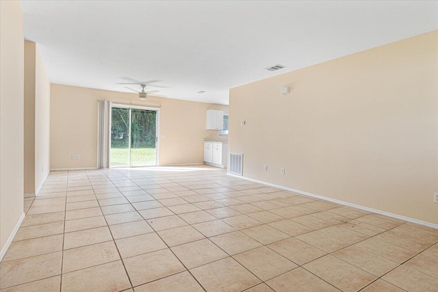 unfurnished room featuring ceiling fan and light tile patterned floors