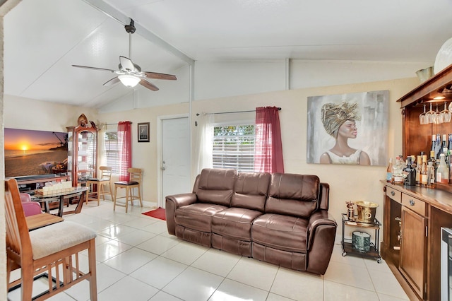 tiled living room with lofted ceiling, bar area, and ceiling fan