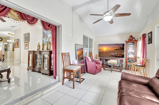 tiled living room with high vaulted ceiling, a healthy amount of sunlight, and ceiling fan with notable chandelier