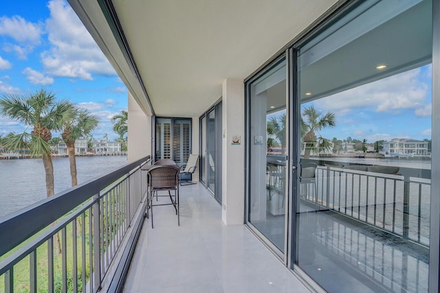 balcony featuring a water view