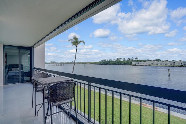 balcony featuring a water view