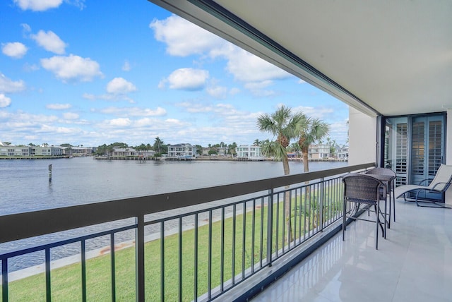 balcony featuring a water view